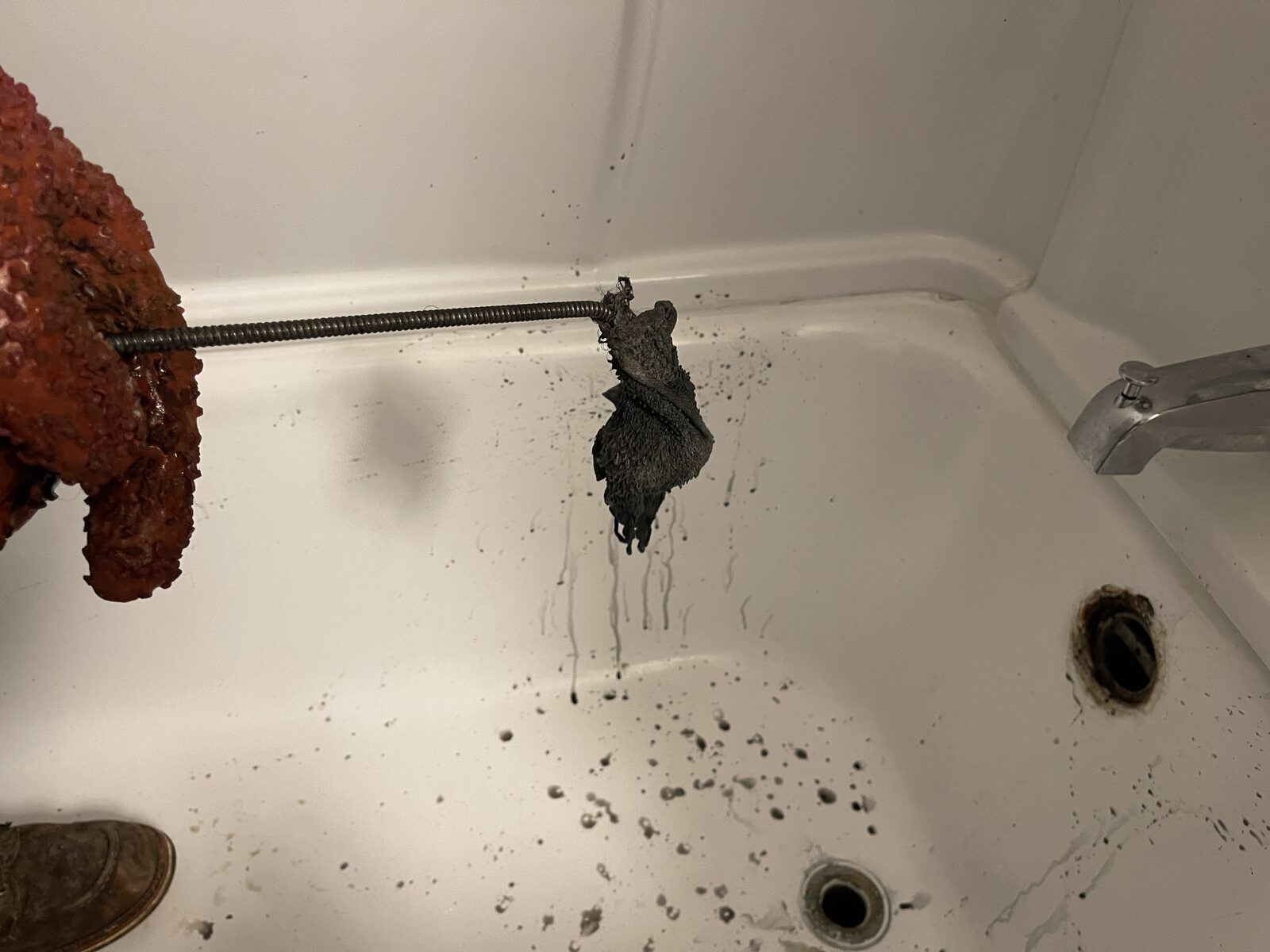 Hairball pulled out of a tub drain on a drain machine cable